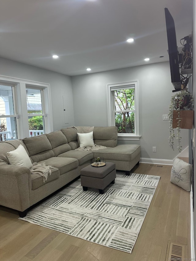 60 Carlson Ave, Bridgeport, CT 06606 - living area with wood finished floors, plenty of natural light, and recessed lighting