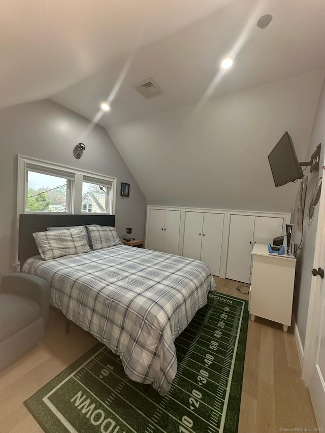 60 Carlson Ave, Bridgeport, CT 06606 - bedroom with vaulted ceiling and light wood-type flooring