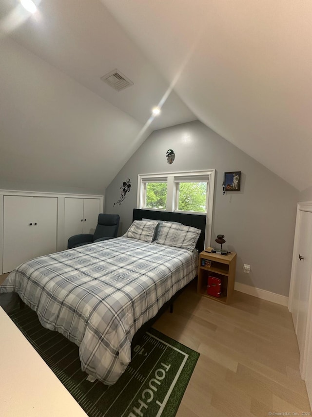 60 Carlson Ave, Bridgeport, CT 06606 - bedroom featuring vaulted ceiling and light wood-style flooring