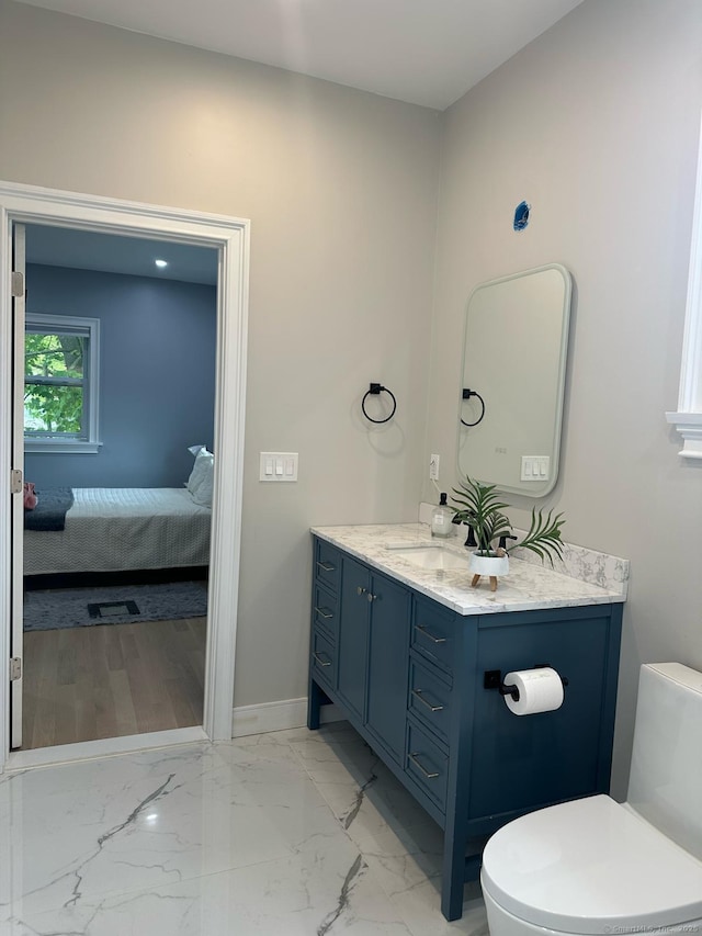 60 Carlson Ave, Bridgeport, CT 06606 - bathroom featuring vanity, connected bathroom, and marble look tiles