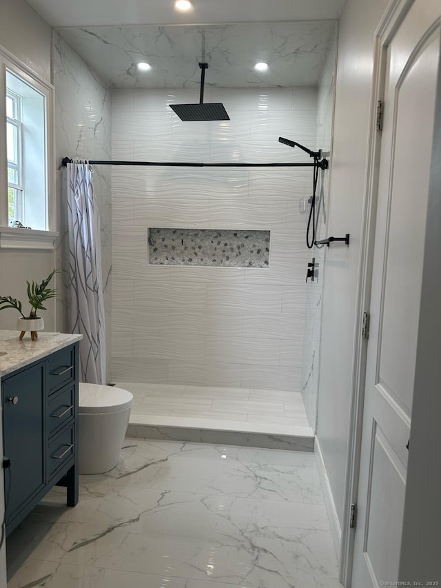 60 Carlson Ave, Bridgeport, CT 06606 - bathroom featuring tiled shower, marble finish flooring, vanity, and recessed lighting
