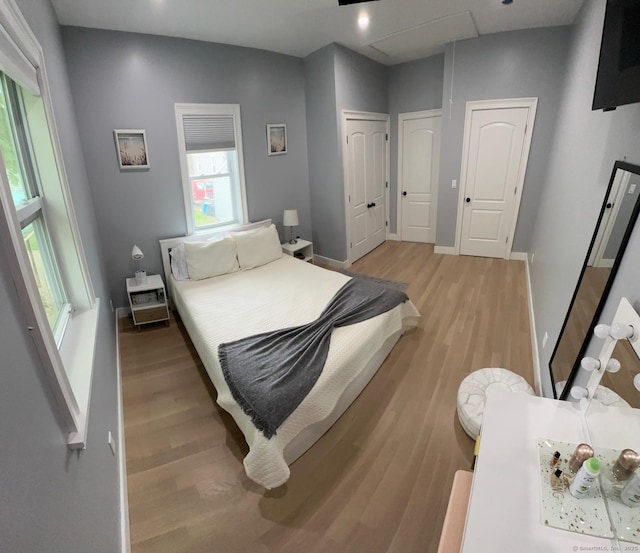 60 Carlson Ave, Bridgeport, CT 06606 - bedroom featuring light wood-style floors, multiple closets, and recessed lighting