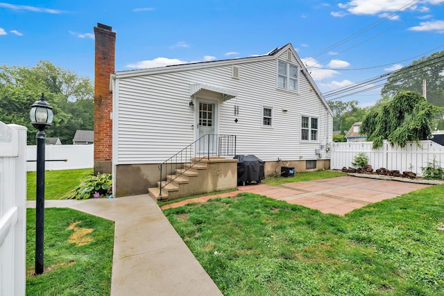 1462 Cutspring Rd, Stratford, CT 06614 - rear view of property featuring a chimney and a patio