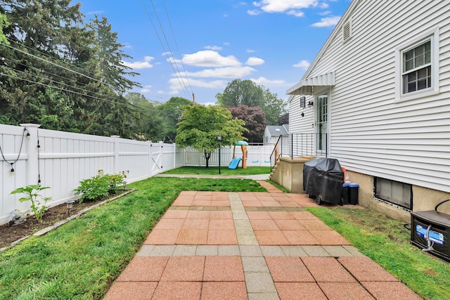 1462 Cutspring Rd, Stratford, CT 06614 - fenced backyard featuring a playground and a patio area