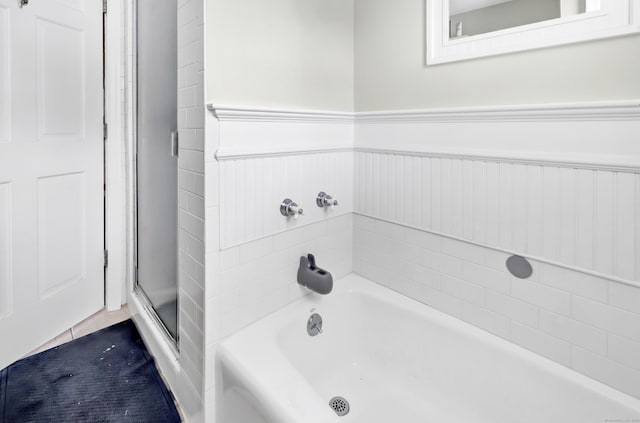 1462 Cutspring Rd, Stratford, CT 06614 - bathroom with a garden tub, wainscoting, and a stall shower