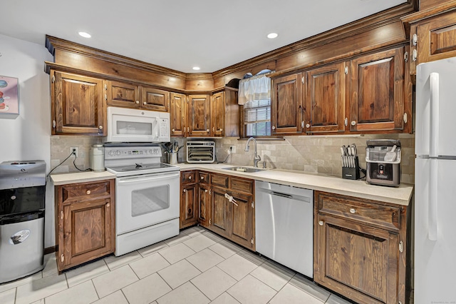 1462 Cutspring Rd, Stratford, CT 06614 - kitchen featuring white appliances, light countertops, tasteful backsplash, light tile patterned floors, and recessed lighting