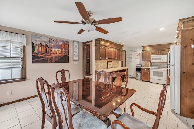 1462 Cutspring Rd, Stratford, CT 06614 - dining area with a ceiling fan, light tile patterned flooring, and recessed lighting