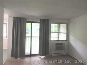 7 Padanaram Rd Unit I184, Danbury, CT 06811 - spare room with a wall mounted AC