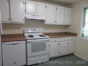 7 Padanaram Rd Unit I184, Danbury, CT 06811 - kitchen featuring white appliances, under cabinet range hood, plenty of natural light, and white cabinets
