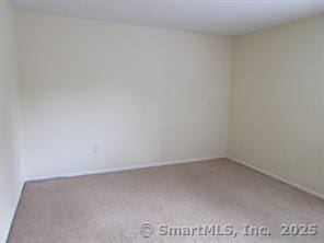 7 Padanaram Rd Unit I184, Danbury, CT 06811 - carpeted empty room featuring baseboards