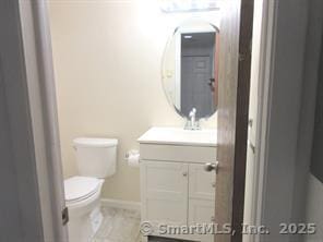 7 Padanaram Rd Unit I184, Danbury, CT 06811 - bathroom featuring vanity and toilet