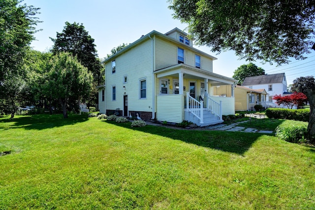 32 Columbus St, East Hartford, CT 06108 - rear view of house with a lawn
