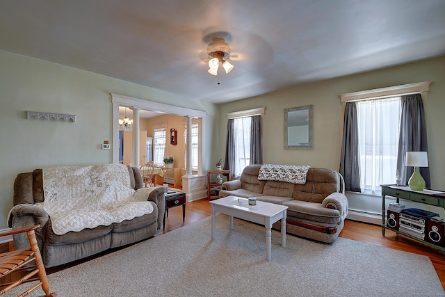 32 Columbus St, East Hartford, CT 06108 - living area featuring a chandelier, healthy amount of natural light, wood finished floors, and a ceiling fan