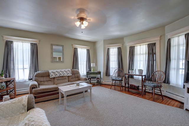 32 Columbus St, East Hartford, CT 06108 - living room featuring ceiling fan, a baseboard heating unit, plenty of natural light, and wood finished floors