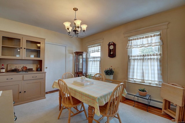32 Columbus St, East Hartford, CT 06108 - dining space with a chandelier, light wood-type flooring, and baseboard heating