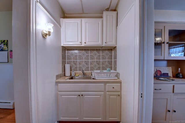32 Columbus St, East Hartford, CT 06108 - bar featuring baseboard heating and decorative backsplash