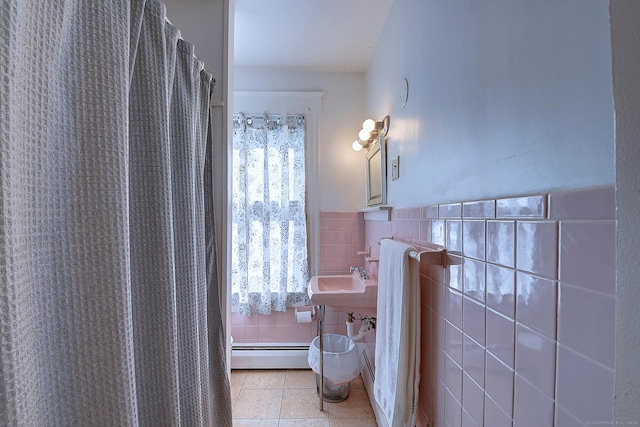 32 Columbus St, East Hartford, CT 06108 - full bathroom with tile patterned floors, tile walls, baseboard heating, and a wainscoted wall