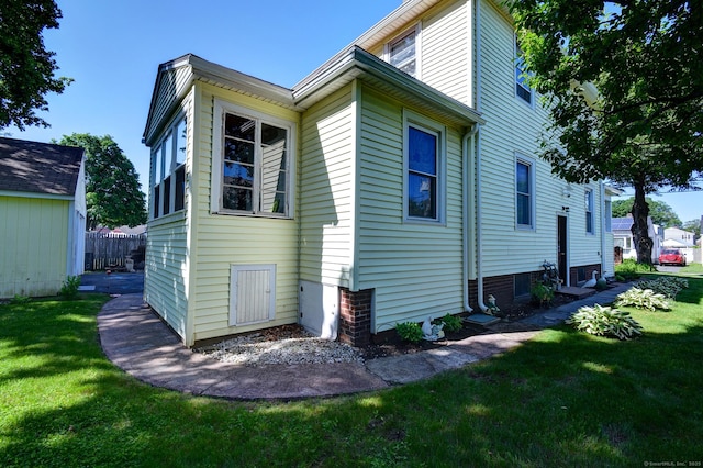 32 Columbus St, East Hartford, CT 06108 - view of side of home with a lawn