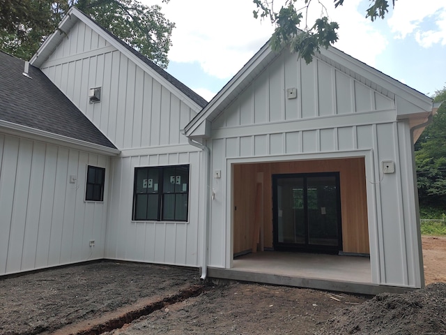 26 Depot Rd, Haddam, CT 06441 - view of exterior entry with a shingled roof and board and batten siding
