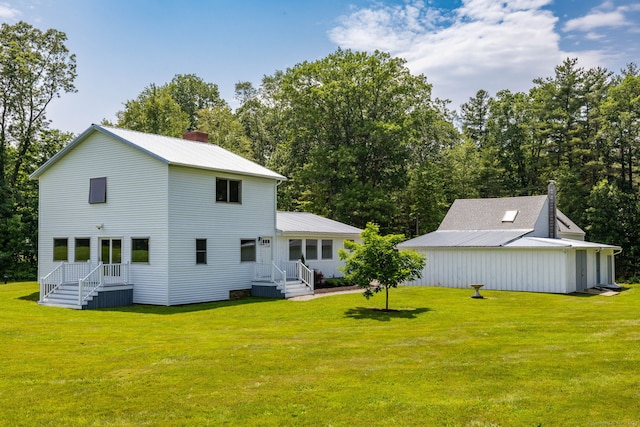 1669 Rte 169, Woodstock, CT 06281 - rear view of house with a chimney, a yard, and a metal roof