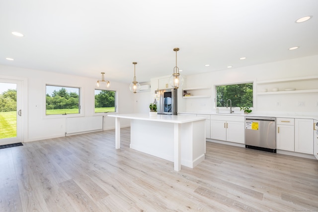 1669 Rte 169, Woodstock, CT 06281 - kitchen featuring open shelves, stainless steel dishwasher, radiator heating unit, plenty of natural light, and recessed lighting