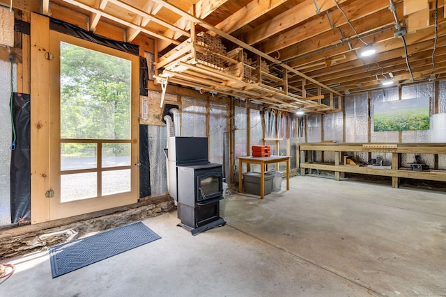 1669 Rte 169, Woodstock, CT 06281 - basement featuring a wood stove and healthy amount of natural light