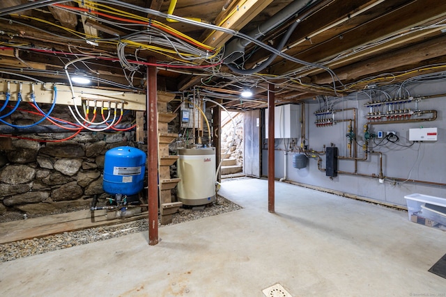 1669 Rte 169, Woodstock, CT 06281 - unfinished basement featuring water heater and a water pressure tank