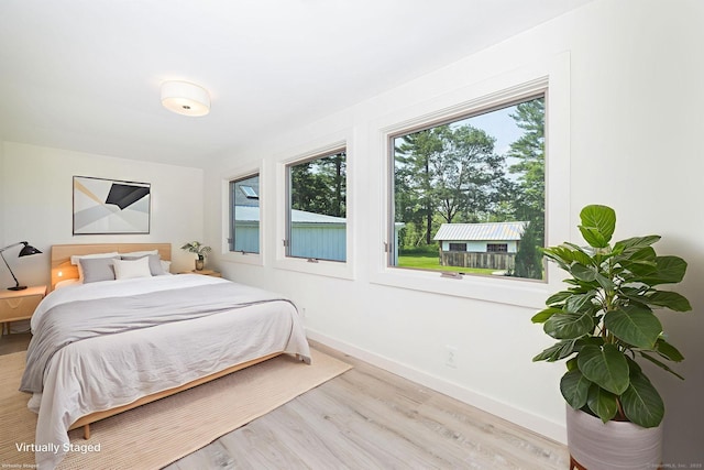 1669 Rte 169, Woodstock, CT 06281 - bedroom with light wood finished floors and baseboards