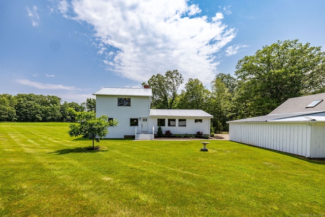 1669 Rte 169, Woodstock, CT 06281 - rear view of house with a lawn, a metal roof, and a chimney