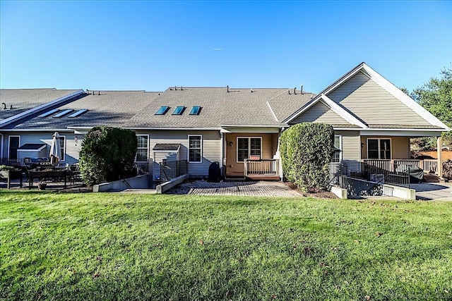 66 Watkins Dr Unit 66, Newtown, CT 06482 - rear view of property with a yard, a patio area, and a shingled roof
