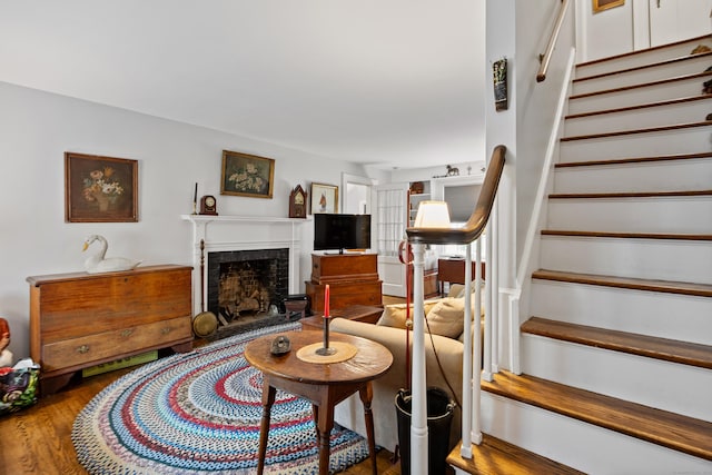 1775 Orchard Hill Rd, Cheshire, CT 06410 - living area featuring stairs, a fireplace with raised hearth, and wood finished floors