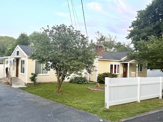 24 Curran St, Norwich, CT 06360 - view of front of home with a chimney and a shingled roof