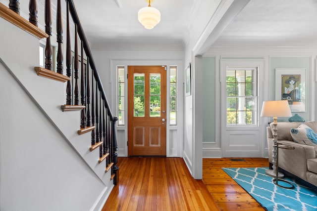 109 Boston Post Rd, Madison, CT 06443 - entryway with hardwood / wood-style floors, stairway, and crown molding