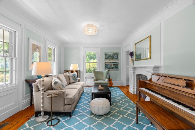 109 Boston Post Rd, Madison, CT 06443 - living area with hardwood / wood-style flooring, a decorative wall, a fireplace, ornamental molding, and built in features
