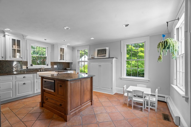 109 Boston Post Rd, Madison, CT 06443 - kitchen with stainless steel appliances, tasteful backsplash, plenty of natural light, glass insert cabinets, and recessed lighting
