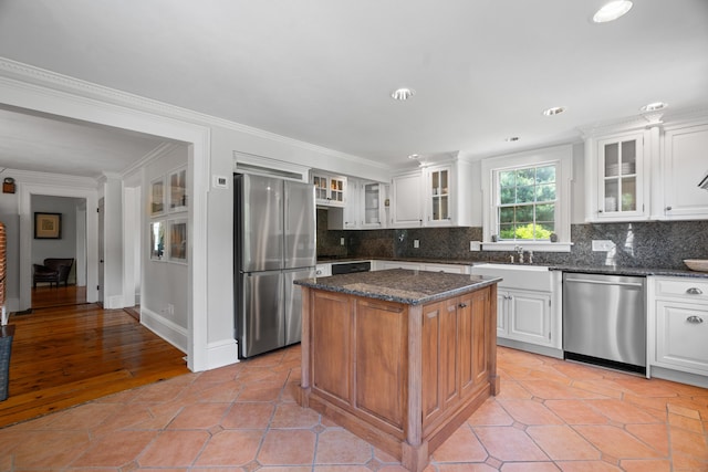 109 Boston Post Rd, Madison, CT 06443 - kitchen with stainless steel appliances, decorative backsplash, white cabinetry, ornamental molding, and recessed lighting