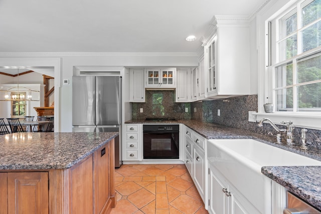 109 Boston Post Rd, Madison, CT 06443 - kitchen featuring black appliances, a chandelier, decorative backsplash, plenty of natural light, and crown molding