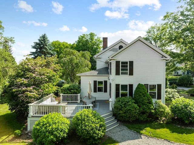 109 Boston Post Rd, Madison, CT 06443 - view of front facade featuring a chimney and a deck