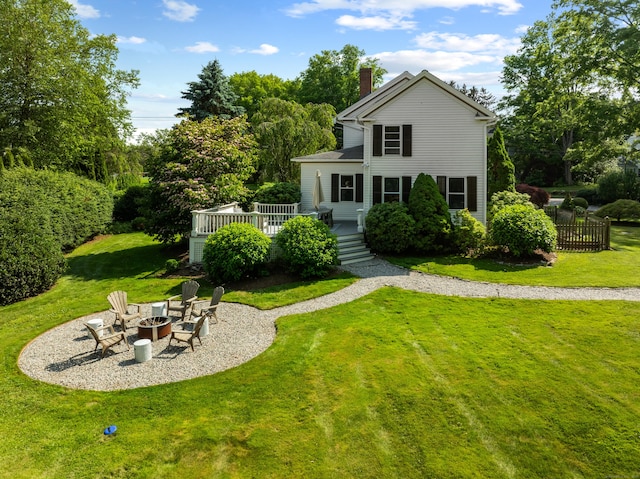 109 Boston Post Rd, Madison, CT 06443 - view of front facade featuring an outdoor fire pit, a deck, and a chimney