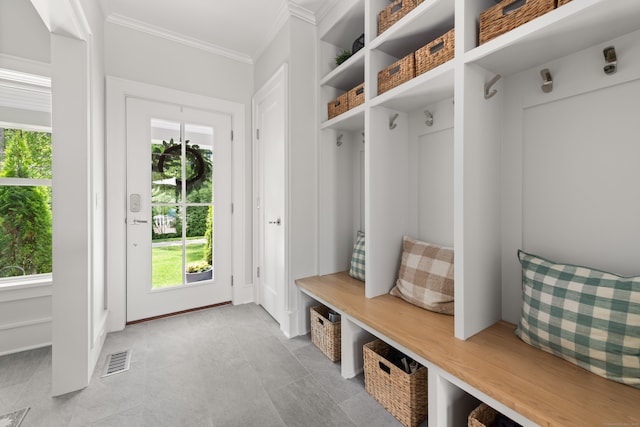 289 Wahackme Rd, New Canaan, CT 06840 - mudroom with plenty of natural light, ornamental molding, and light tile patterned floors