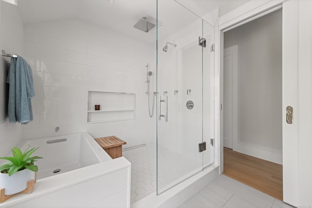 289 Wahackme Rd, New Canaan, CT 06840 - bathroom featuring a shower stall, a garden tub, and tile patterned floors
