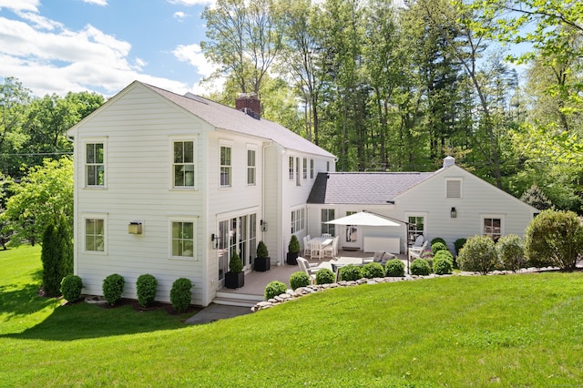 289 Wahackme Rd, New Canaan, CT 06840 - view of front of house with a chimney, a front yard, a deck, and a gazebo