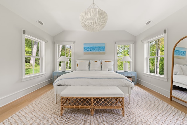 289 Wahackme Rd, New Canaan, CT 06840 - bedroom featuring a chandelier, multiple windows, light wood-style flooring, and vaulted ceiling