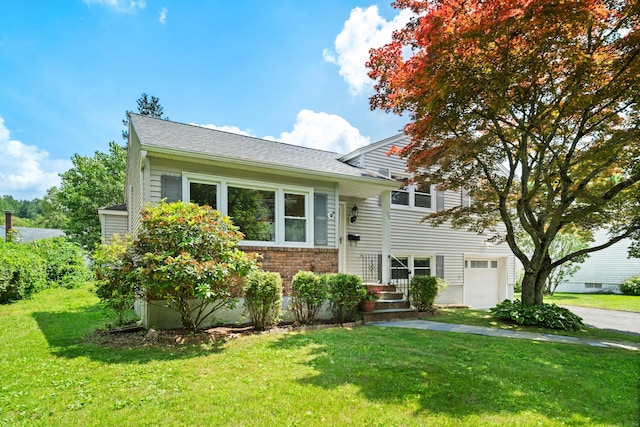 170 Southern Blvd, Danbury, CT 06810 - view of front of house featuring a front yard, brick siding, and an attached garage