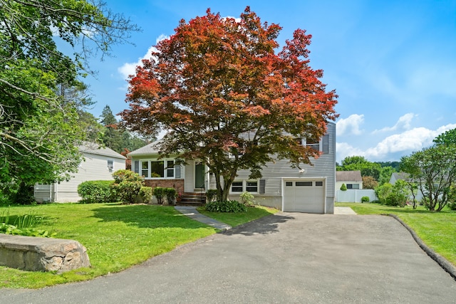 170 Southern Blvd, Danbury, CT 06810 - obstructed view of property with a garage, asphalt driveway, and a front lawn