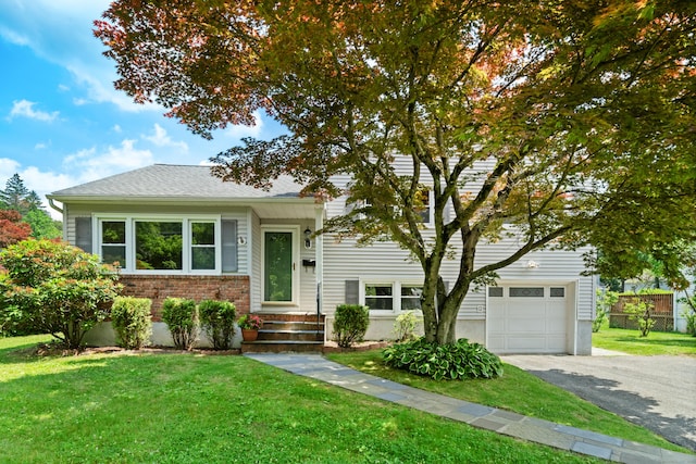 170 Southern Blvd, Danbury, CT 06810 - tri-level home featuring a front lawn, asphalt driveway, and brick siding