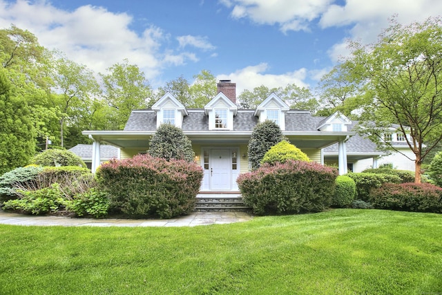 29 Bradley Rd, Weston, CT 06883 - view of front of property with a chimney, a front lawn, and roof with shingles