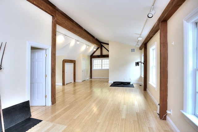 29 Bradley Rd, Weston, CT 06883 - unfurnished living room with rail lighting and light wood-type flooring