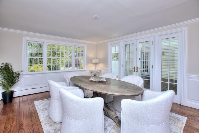 29 Bradley Rd, Weston, CT 06883 - dining space with hardwood / wood-style flooring, crown molding, french doors, a decorative wall, and a wainscoted wall