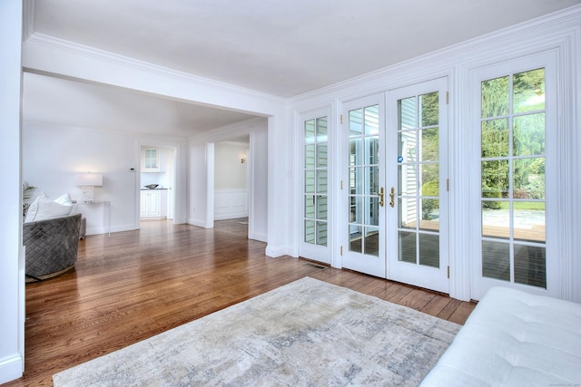29 Bradley Rd, Weston, CT 06883 - doorway with french doors, crown molding, and wood finished floors